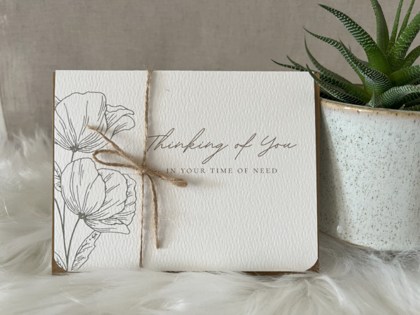 Sympathy card displaying teal tulips and a comforting sentiment