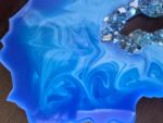 Blue Vortex Resin geode slice center ring of crystals-stand included