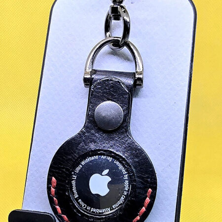 Black leather apple air tag case with red stitching