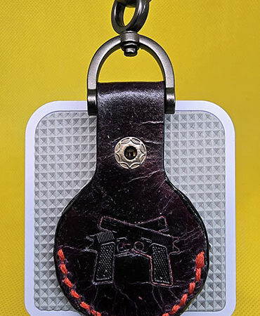 Apple AirTag Holder with Debossed Guns and Red Stitching Handcrafted from Premium Quality Veg-Tanned Leather