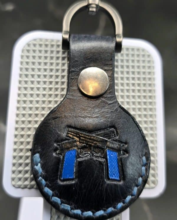 Veg-tanned Leather Apple AirTag Holder with Navy Handled Guns Handcrafted from Premium Quality Veg-Tanned Leather