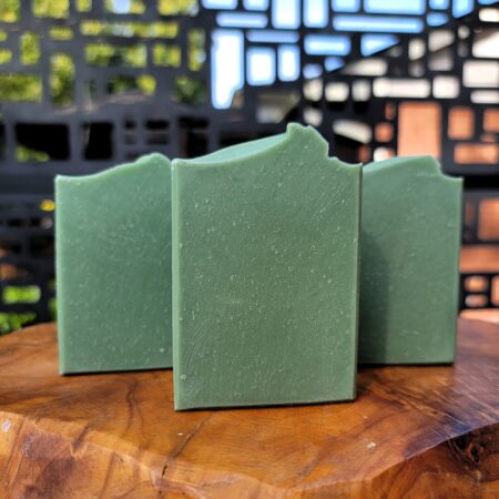 Lime eucalyptus mint handmade soap. Three green bars on wooden surface