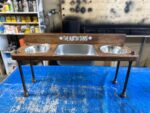 Raised water bin with 2 bowls on each end. Water Bin and Dual Feeder - tall dog bowl stand