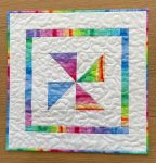 Quilted Colourful Pinwheel Table Topper