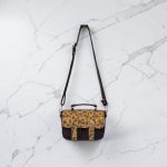 Eggplant color with accent purple flower cork fabric, rose gold hardware, minimalist bag.