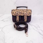 Eggplant color with accent purple flower cork fabric, rose gold hardware, minimalist bag.