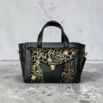 Structured Black Faux Leather Bag, Gold Floral Accent, Press Lock Hardware