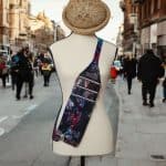 Red floral print slouch bag, matte black hardware.