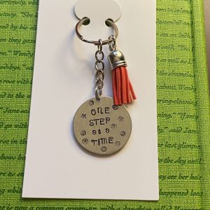 ‘one step at a time’ hand stamped keychain