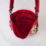 Red floral print slouch bag, matte black hardware.