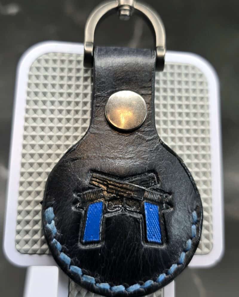 Leather-Apple-AirTag-Holder-with-Navy-Guns-AT18D-e1748012599744