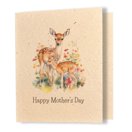 A greeting card printed on textured kraft seed paper. The card features a tender watercolour illustration of a mother doe standing protectively beside her spotted fawn, surrounded by delicate wildflowers in shades of red, pink, and yellow. Below the illustration, classic black serif text reads "Happy Mother's Day."