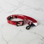 Red floral print slouch bag, matte black hardware.