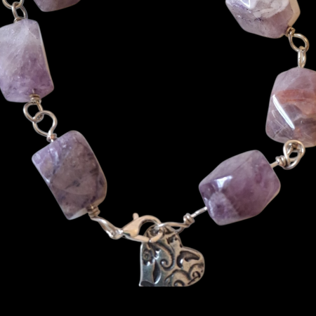 close up of beads and charm on amethyst chunky bracelet