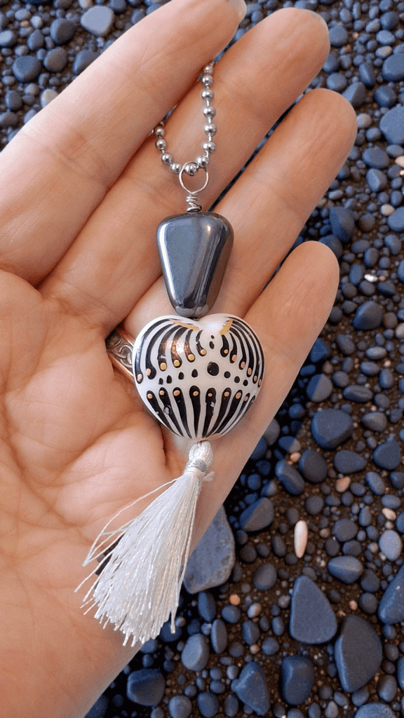 hematite-heart-pendant-in-hand