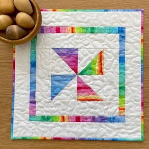 Quilted Colourful Pinwheel Table Topper