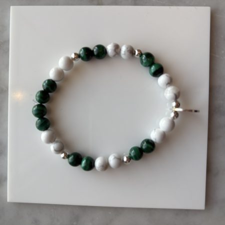White howlite and green malachite bracelet with sterling silver beads and a sterling silver stamping disc centerpiece.