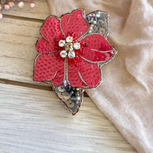 Red poinsettia brooch